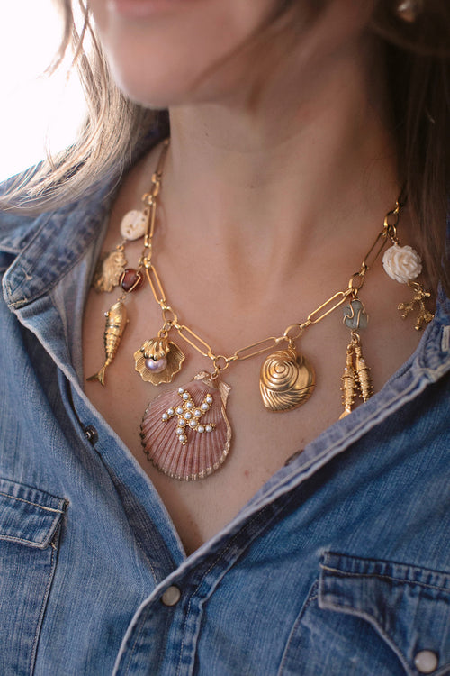 Gold-tone shell charm necklace with multiple hanging seashell pendants