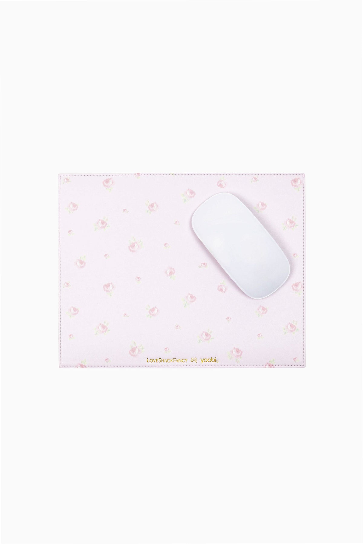 Pink and white ditsy mouse pad with small floral motifs; mouse resting