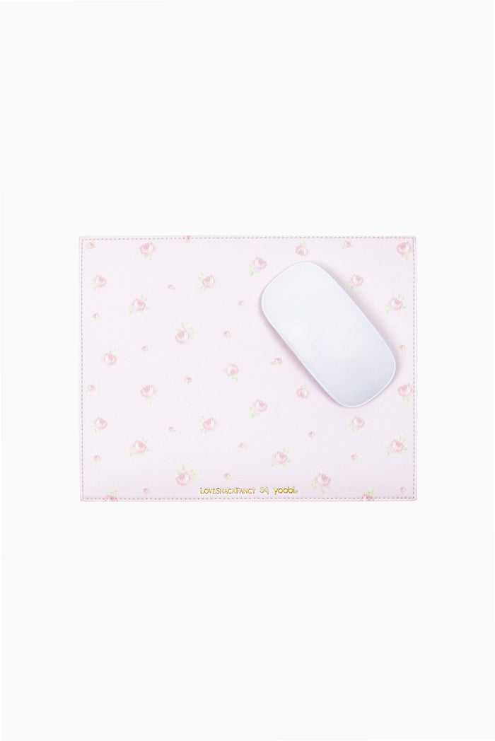 Pink and white ditsy mouse pad with small floral motifs; mouse resting