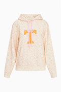 Cream floral pullover hoodie front view with hood drawstring and orange graphic