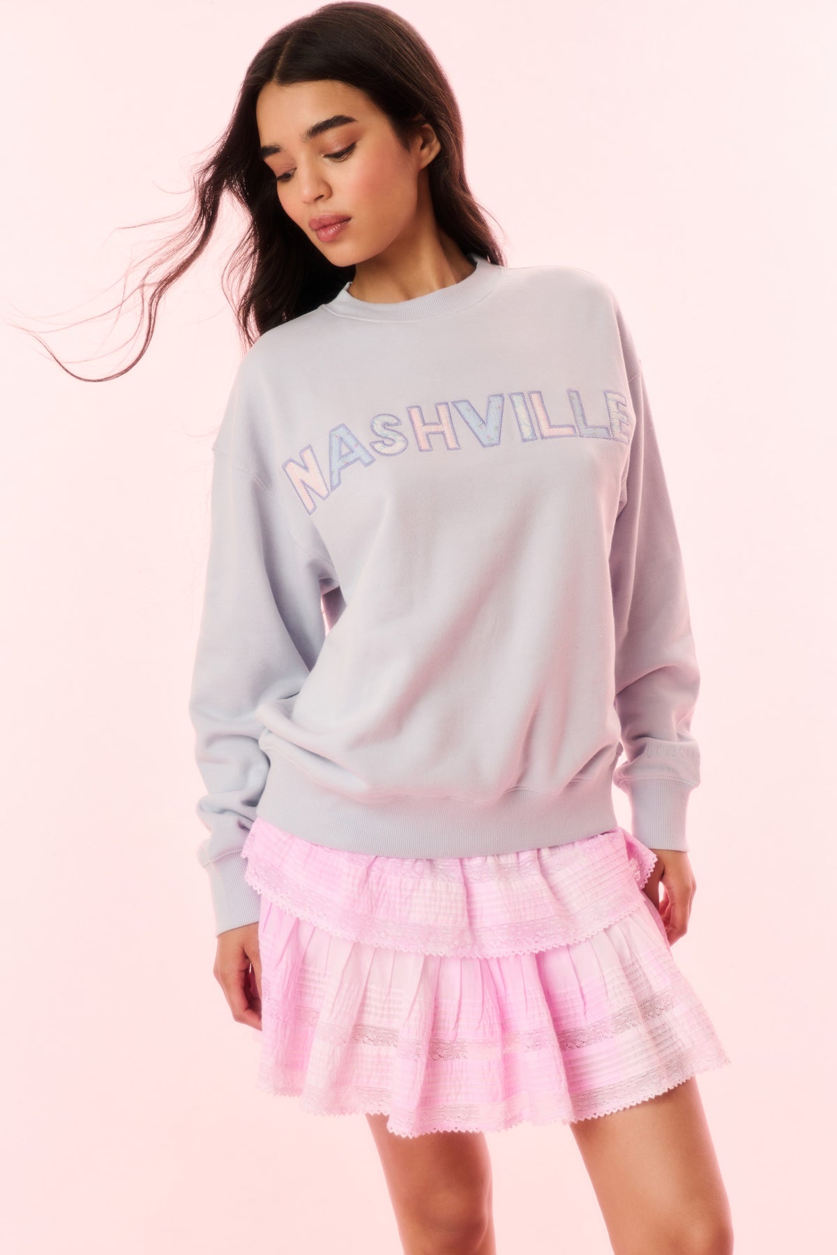 Light lavender pullover sweatshirt with NASHVILLE graphic on back and ribbed neckline