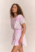 Pink mini dress with tiered ruffle layers and gathered waist