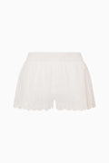 White cotton cover-up shorts with scalloped lace hem and eyelet details