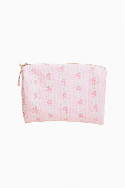 Quilted cotton cosmetic bag with pink floral pattern and gold zipper, zipper pull loop