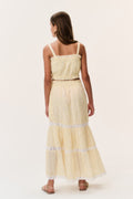 Light yellow tiered tween skirt with lace-trim bands, back view