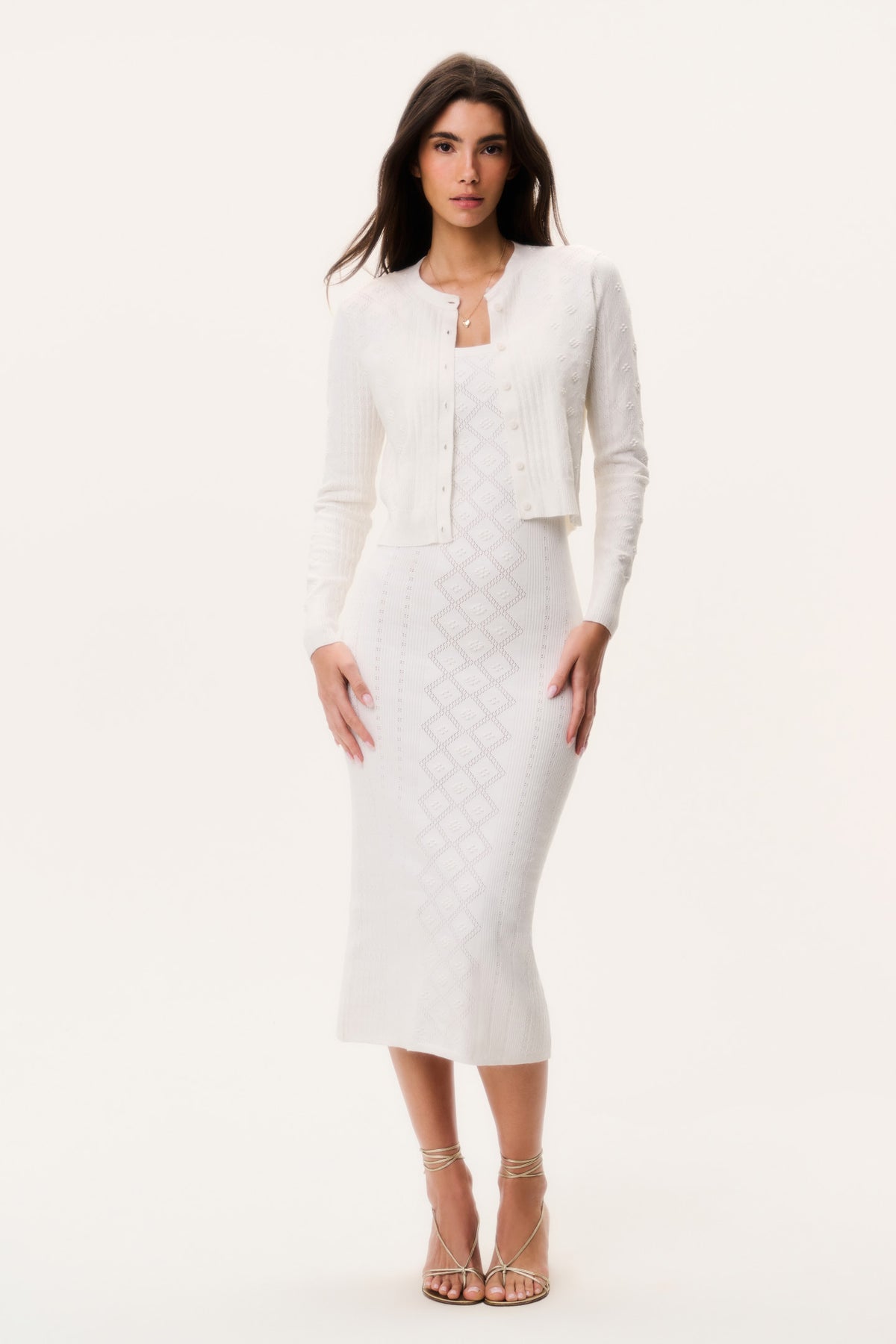Off-white cotton pointelle cardigan over matching knit skirt, button-front, long sleeves