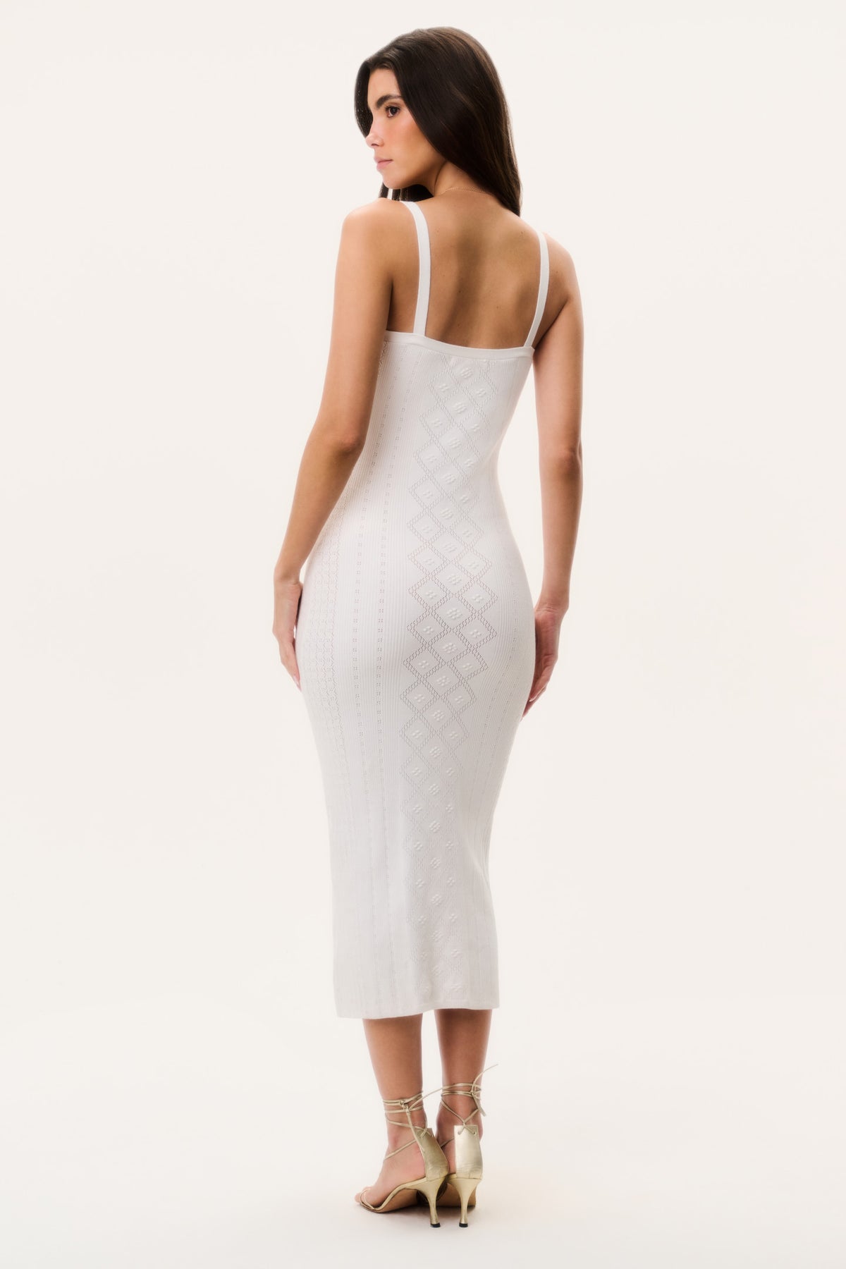 Back view of off-white pointelle midi dress with spaghetti straps