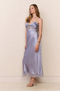 Light blue satin maxi dress with spaghetti straps and lace-trim hem