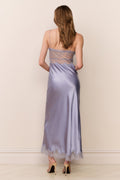 Light blue satin maxi dress with open back, spaghetti straps, and lace-trim hem