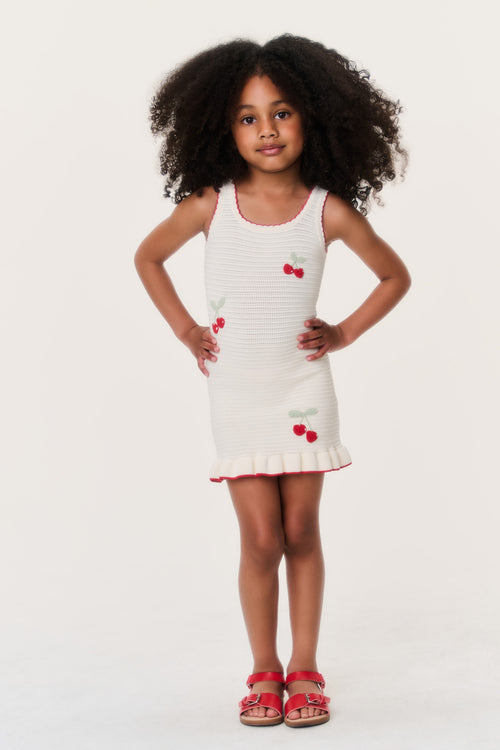 Girls cherry sundress-style dress, cream knit, red trim and cherry graphics on front