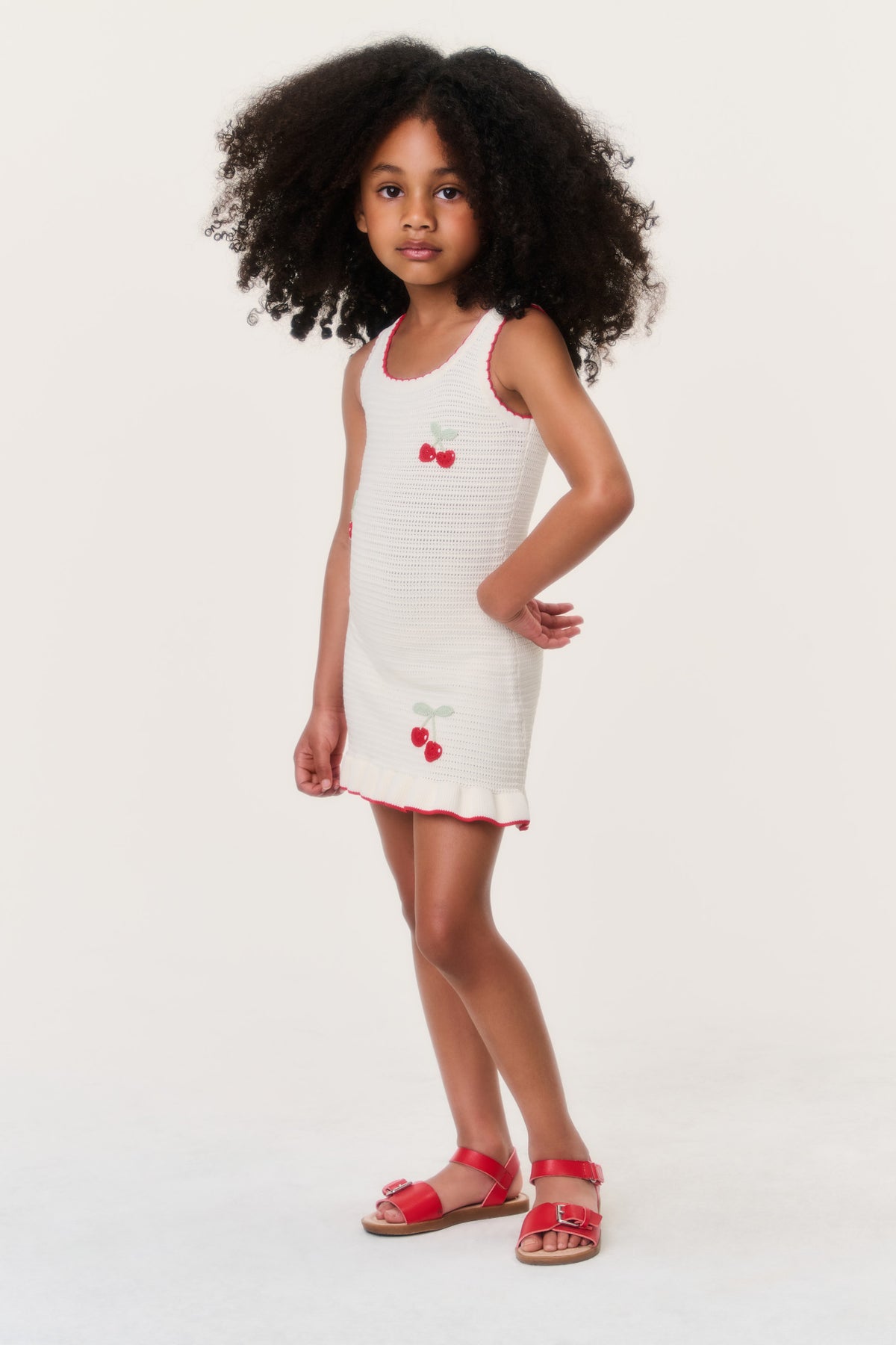 Girls sleeveless cream cherry dress with red cherry embroidery, fitted bodice and hem