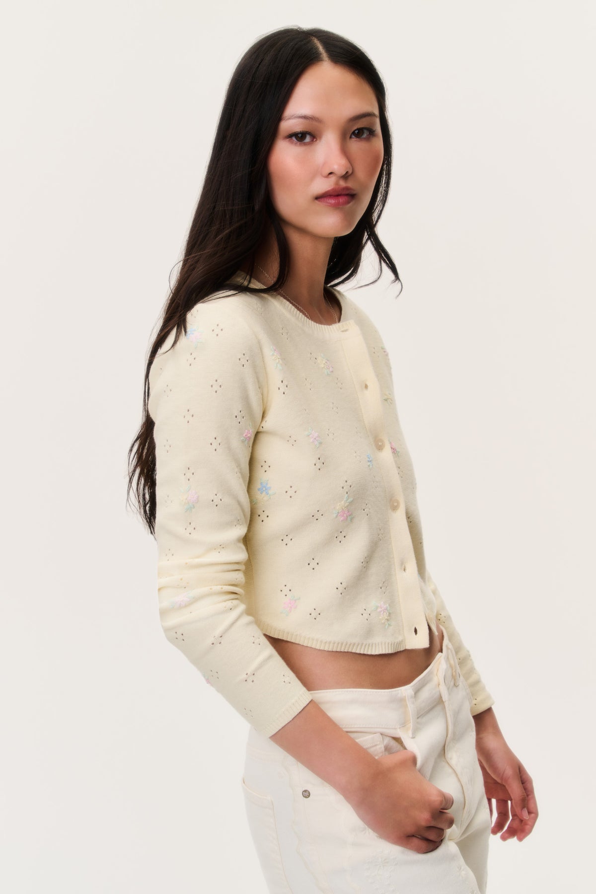 Pale yellow embroidered floral cardigan with button front and cropped hem, long sleeves