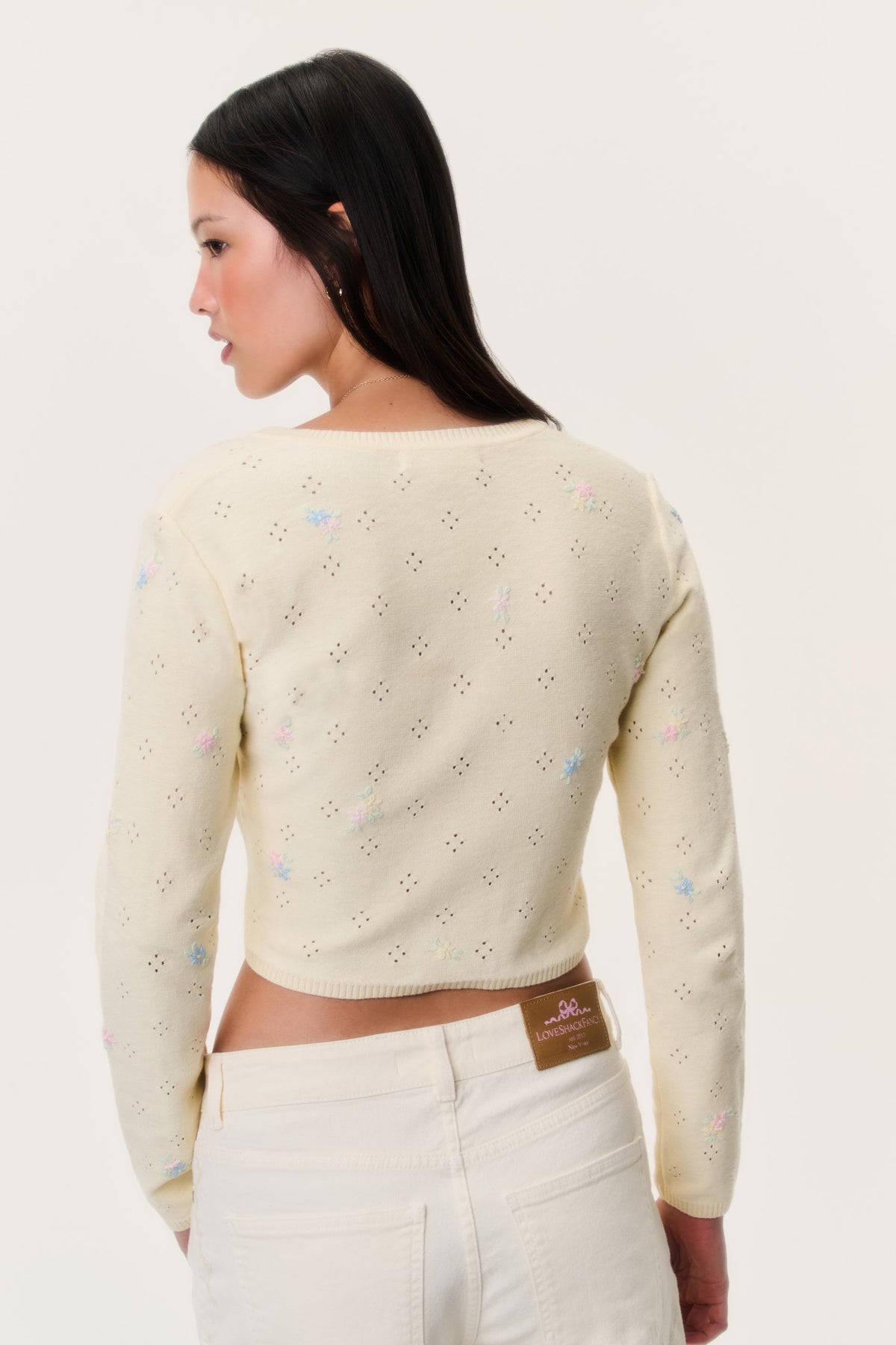 Pale yellow embroidered floral cardigan back view with knit button front and long sleeves