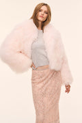 Pale pink shearling jacket with fluffy faux fur, open front and long sleeves