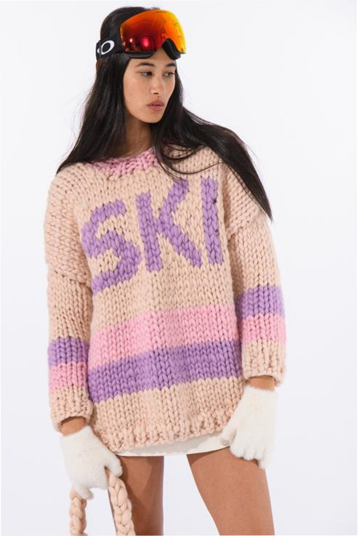 Knitted ski sweater in cream with purple and pink 'SKI' lettering