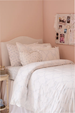 Light white duvet cover set with embroidered bow and matching sham, subtle dotted pattern