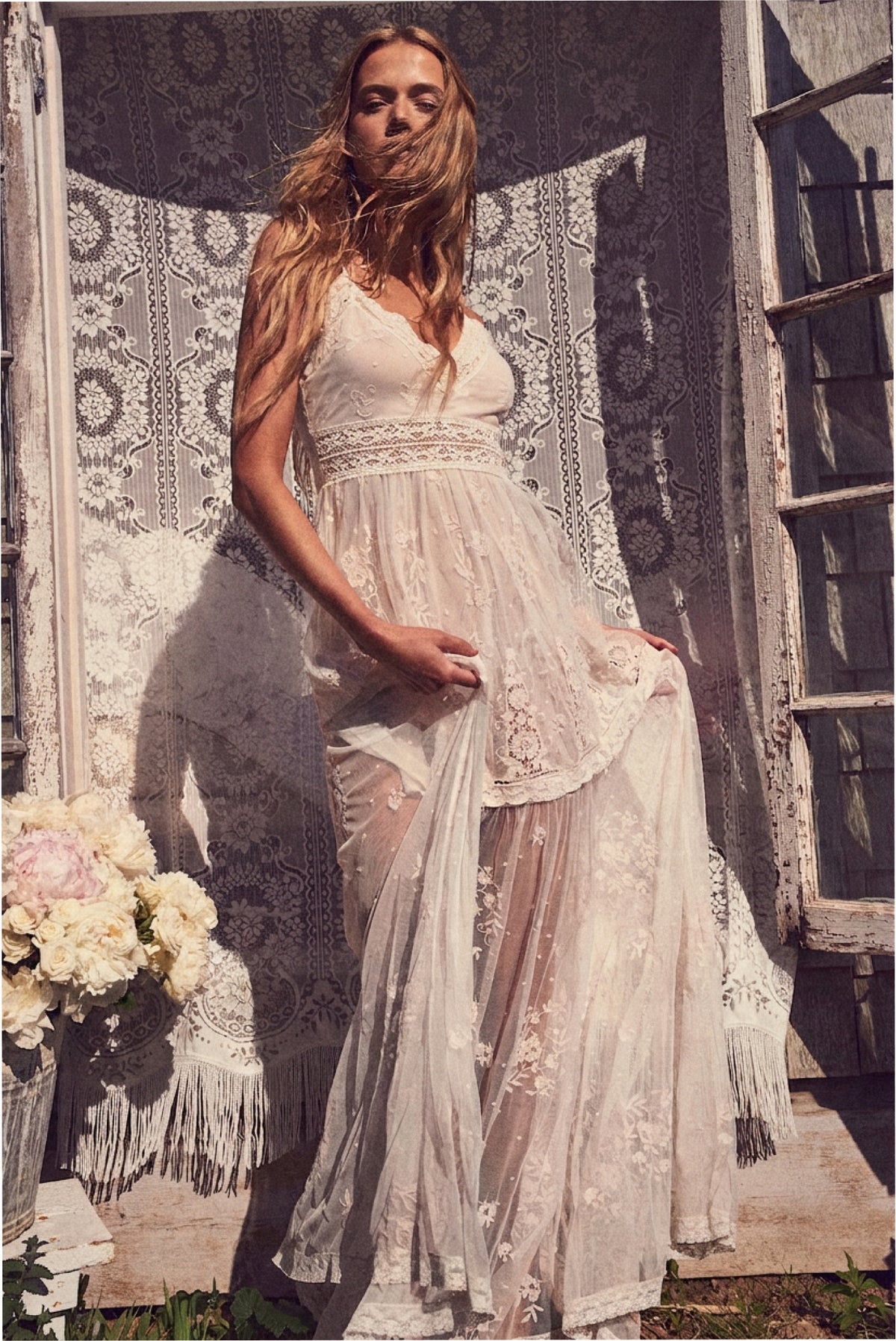 Ivory embroidered tulle maxi dress with V-neck bodice and flowing tiered layers