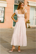 Pink floral cotton maxi dress with puff sleeves, smocked waist, and tiered skirt