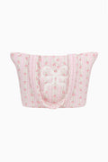 Quilted cotton tote bag in light pink with floral pattern and bow detail