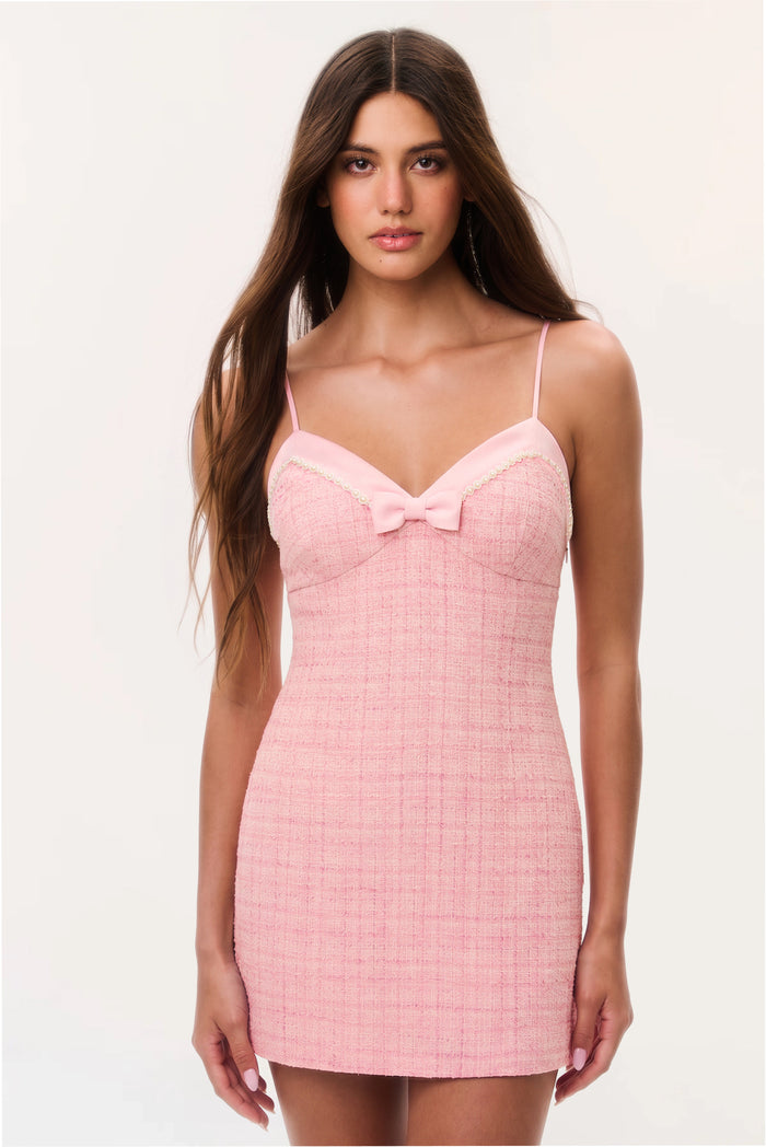 Pink tweed mini dress with spaghetti straps and front bow neckline