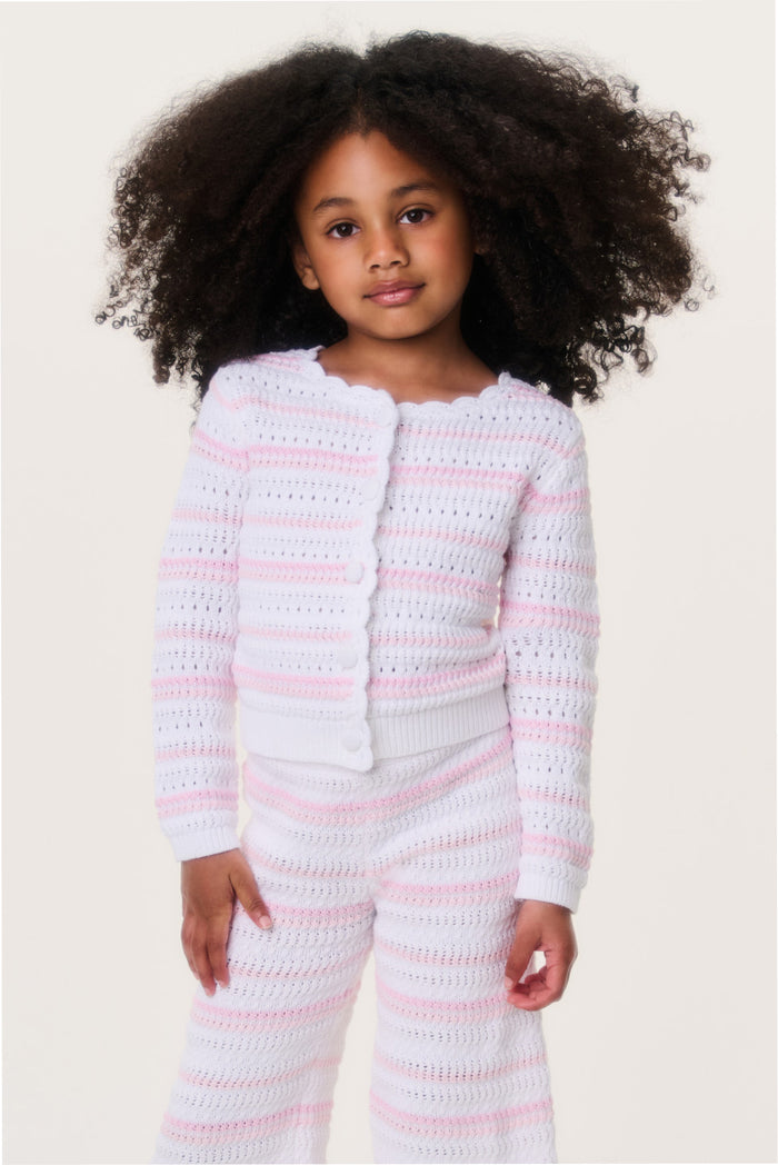 Girls crochet cardigan close-up, pink-and-white striped knit with button front.
