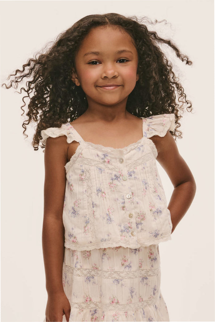 Little girls Norina top close-up: floral print, ruffle trim shoulders, button detail