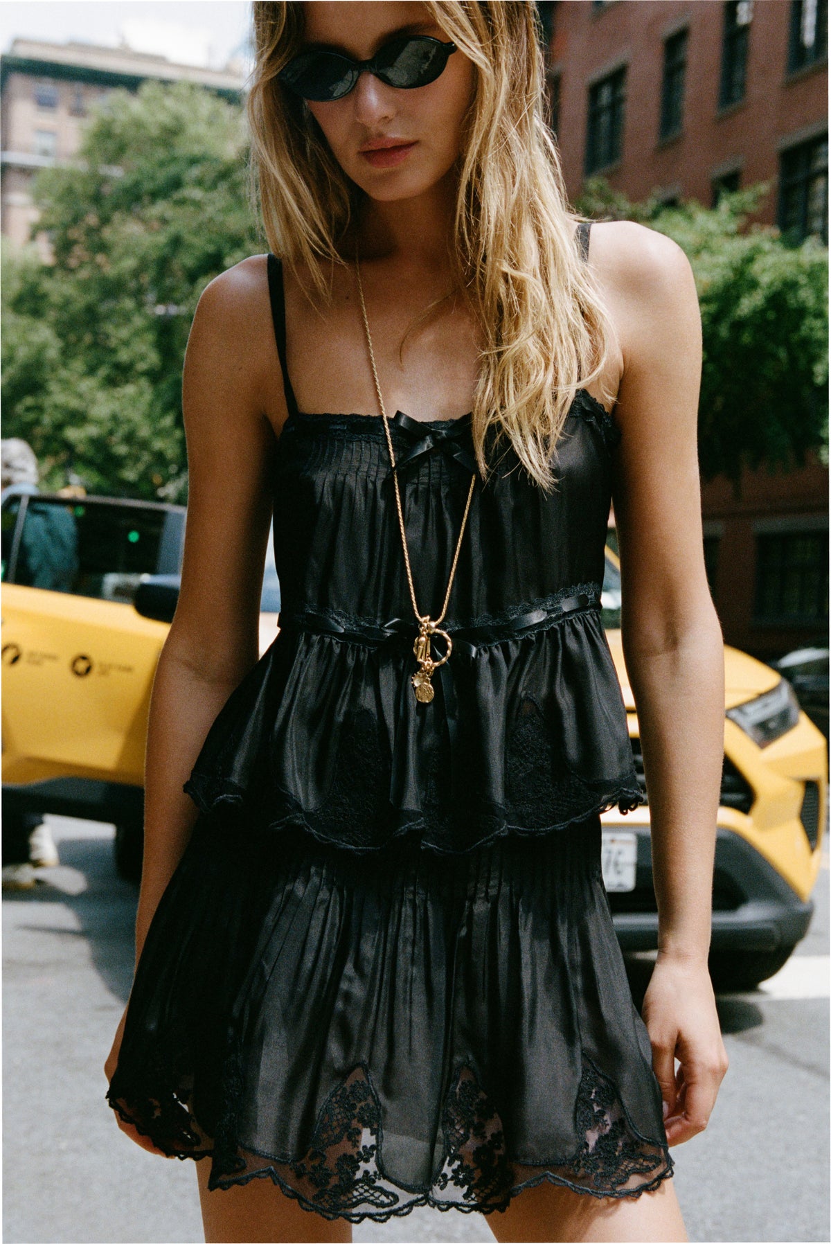 Silk lace mini skirt in black with tiered skirt layers and lace hem
