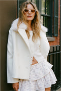 Winter white wool peacoat with faux fur collar and double-breasted button front