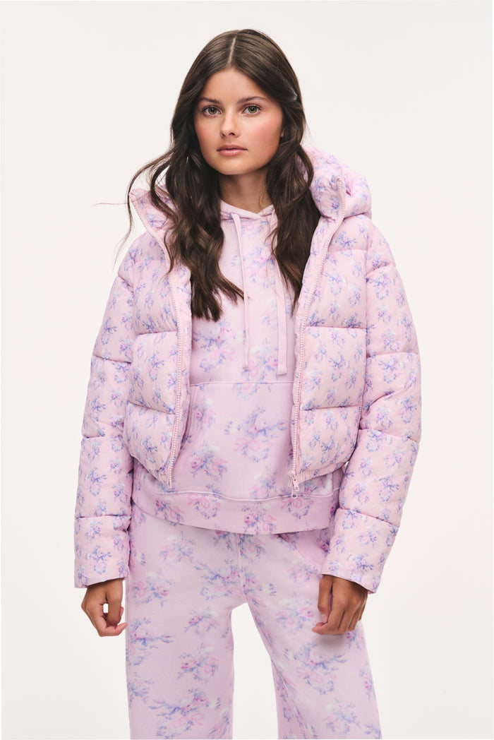Tween lilac floral puffer jacket with hood, front zipper, and quilted panels