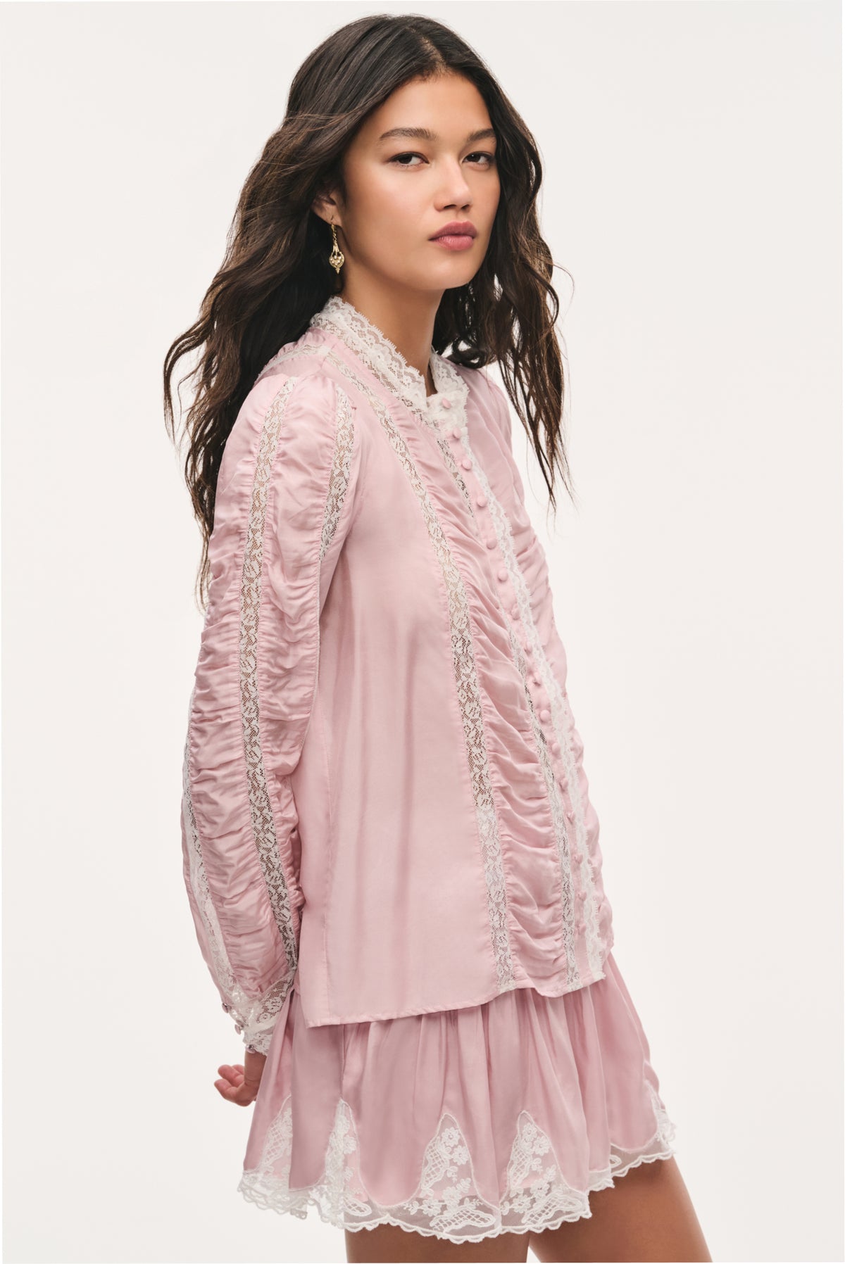 Pink silk lace blouse with embroidered lace stripes and ruffled neckline, long sleeves