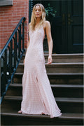 Light pink maxi dress with spaghetti straps, V-neck, and side slit, patterned fabric.