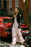 Dark cropped shearling jacket with fur-trimmed cuffs and button front