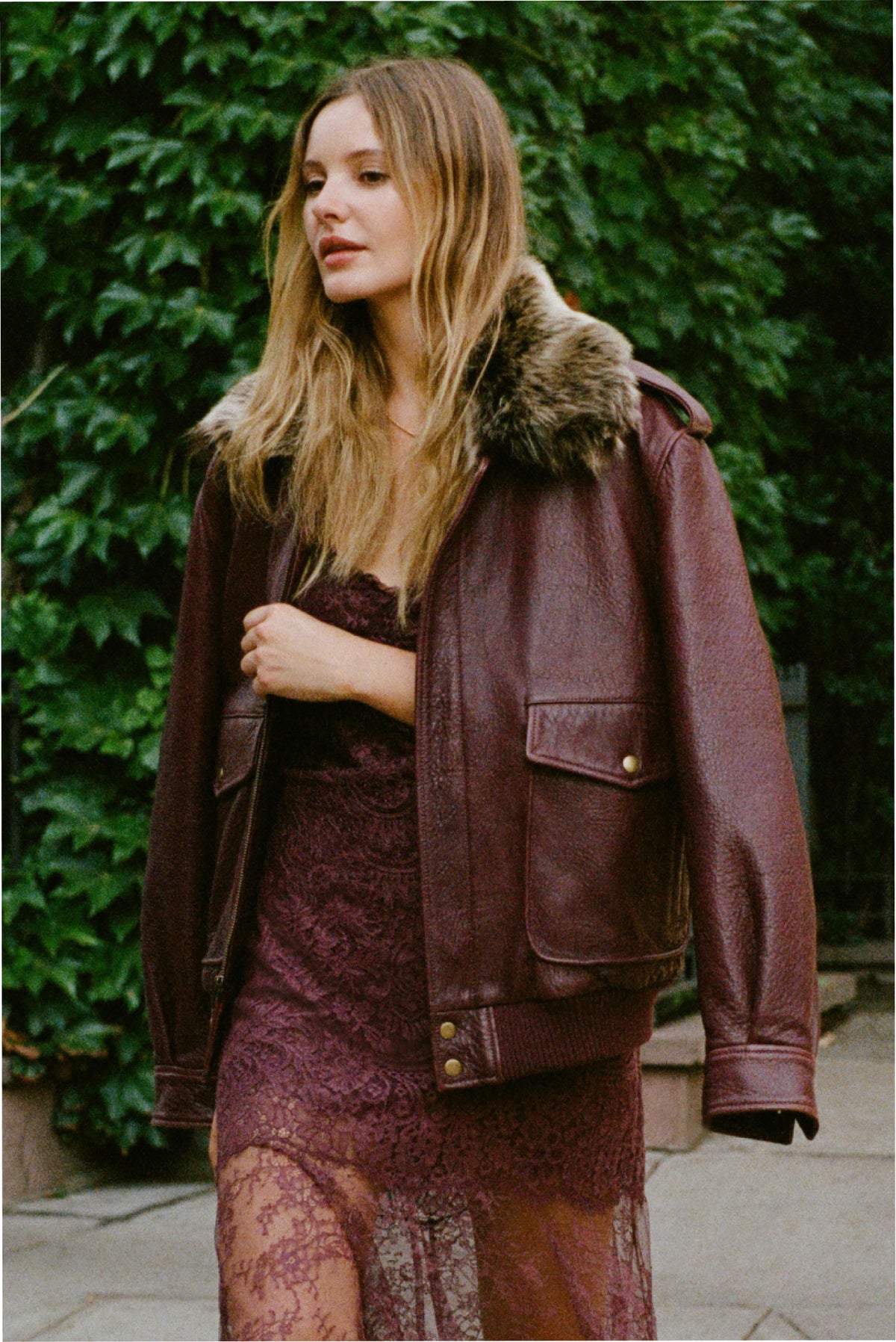 Faded merlot leather bomber jacket with faux fur collar, front zip and chest pockets