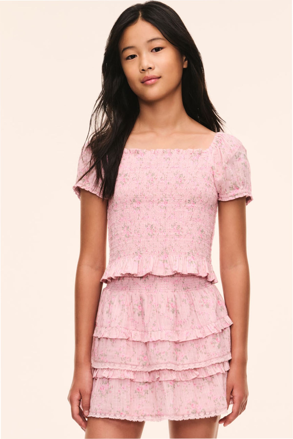 Pink floral tween puff-sleeve top with square neckline and tiered ruffle peplum hem