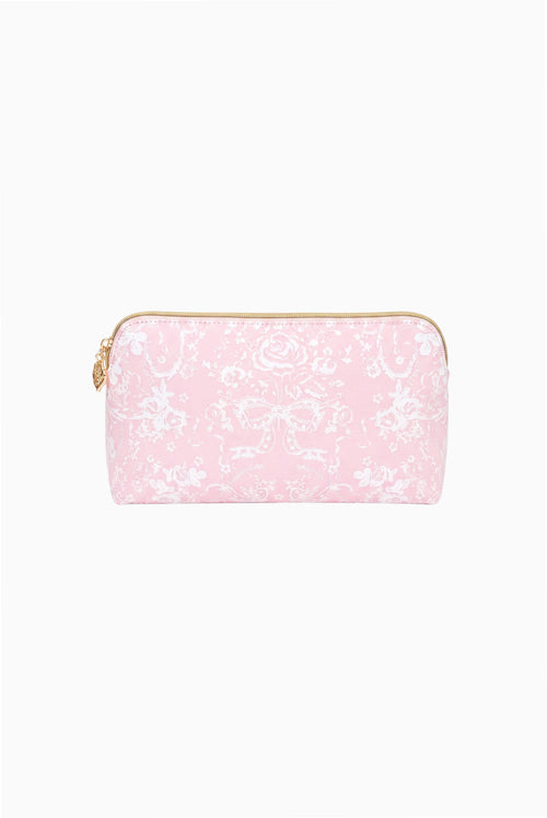 Small travel pouch with pink toile print, zip closure, and rounded top edges