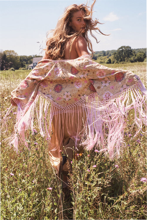Floral embroidered boho top with pink lace trim and long fringe tassels