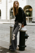Lace appliqué wide-leg jeans with floral accents