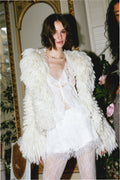 Off-white lace mini skirt with scalloped hem and delicate lace trim, front view