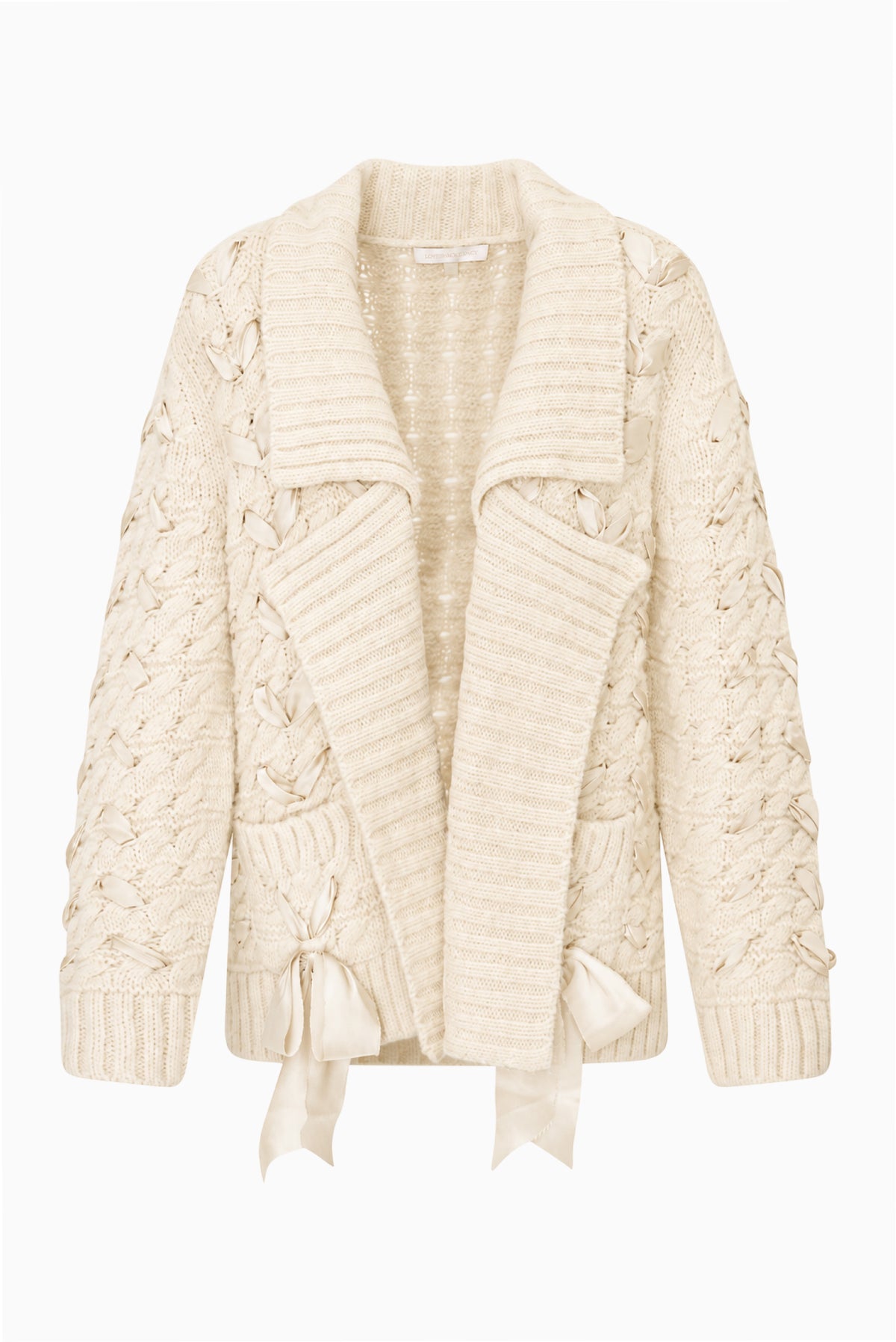 Windel cardigan product shot: ivory textured knit cardigan, open front with shawl collar, ribbon laced through the front, and ribbon bows on the pockets