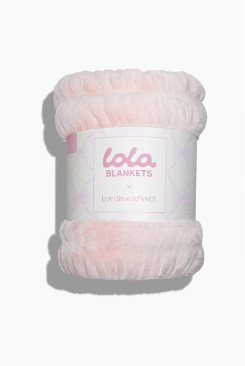 Petal pink plush blanket roll with LoveBlankets label and LoveShackFancy logo