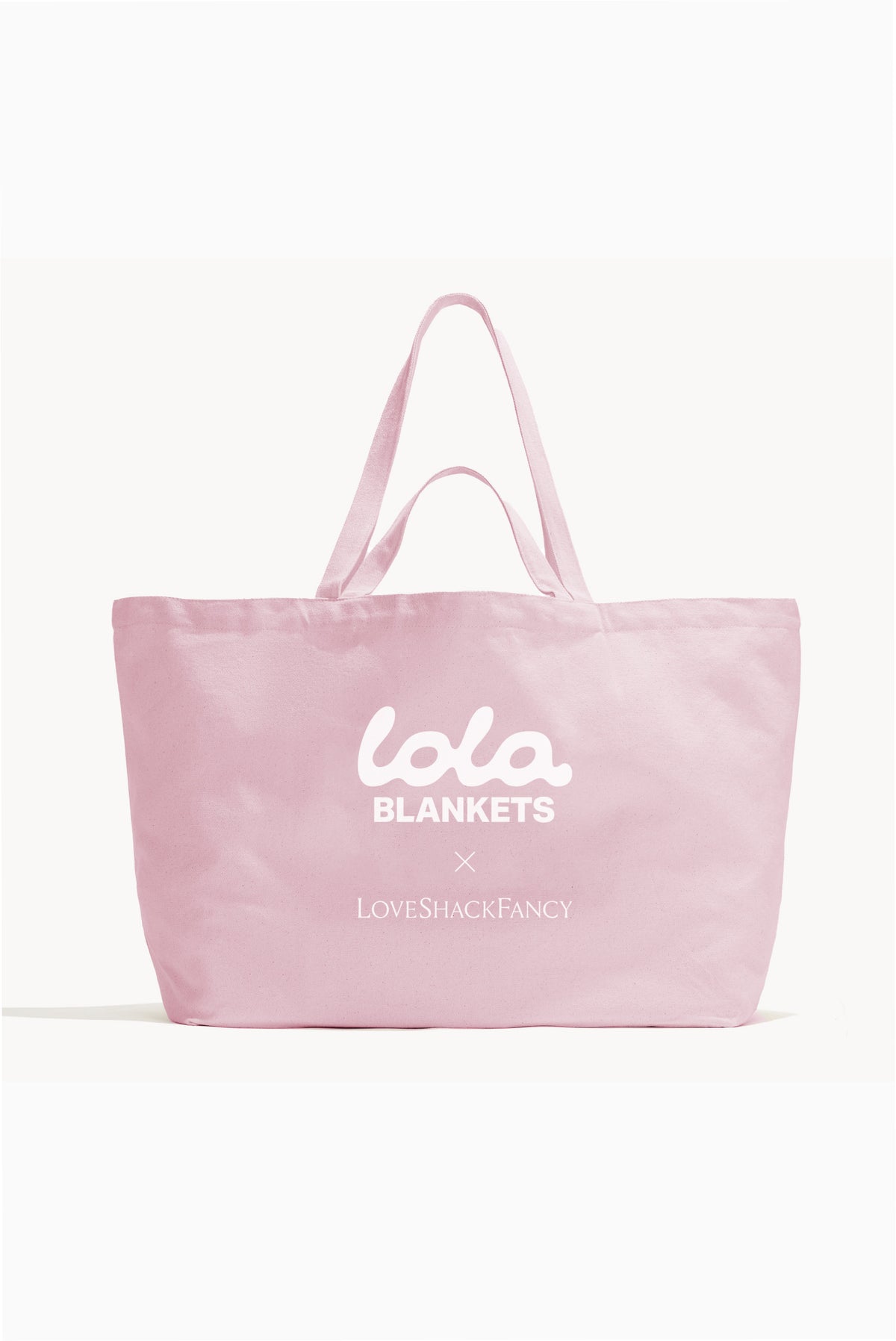 Pink tote bag with LoveShackFancy and Lola Blankets logo