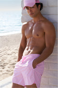 Mens pink patterned swim shorts with drawstring waist and above-knee length