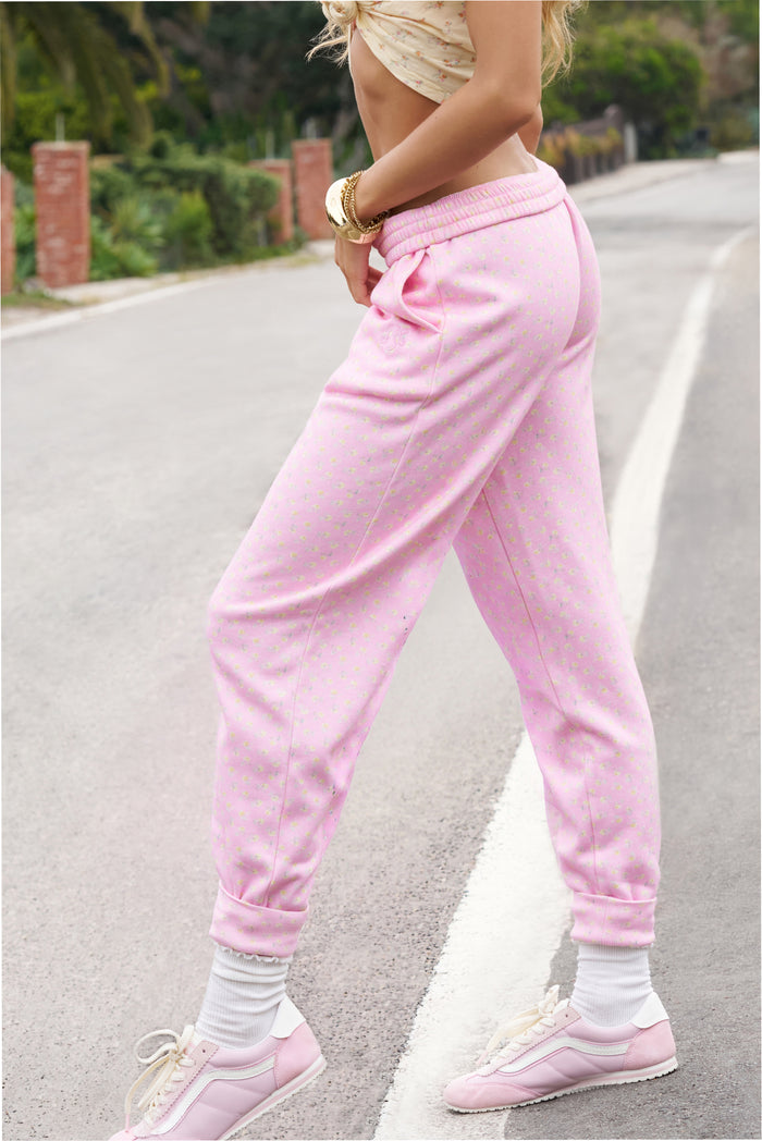 Pink ditsy floral sweatpants with elastic cuffs