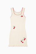 Kids sleeveless cream dress with red cherry prints and ribbed texture, ruffle hem