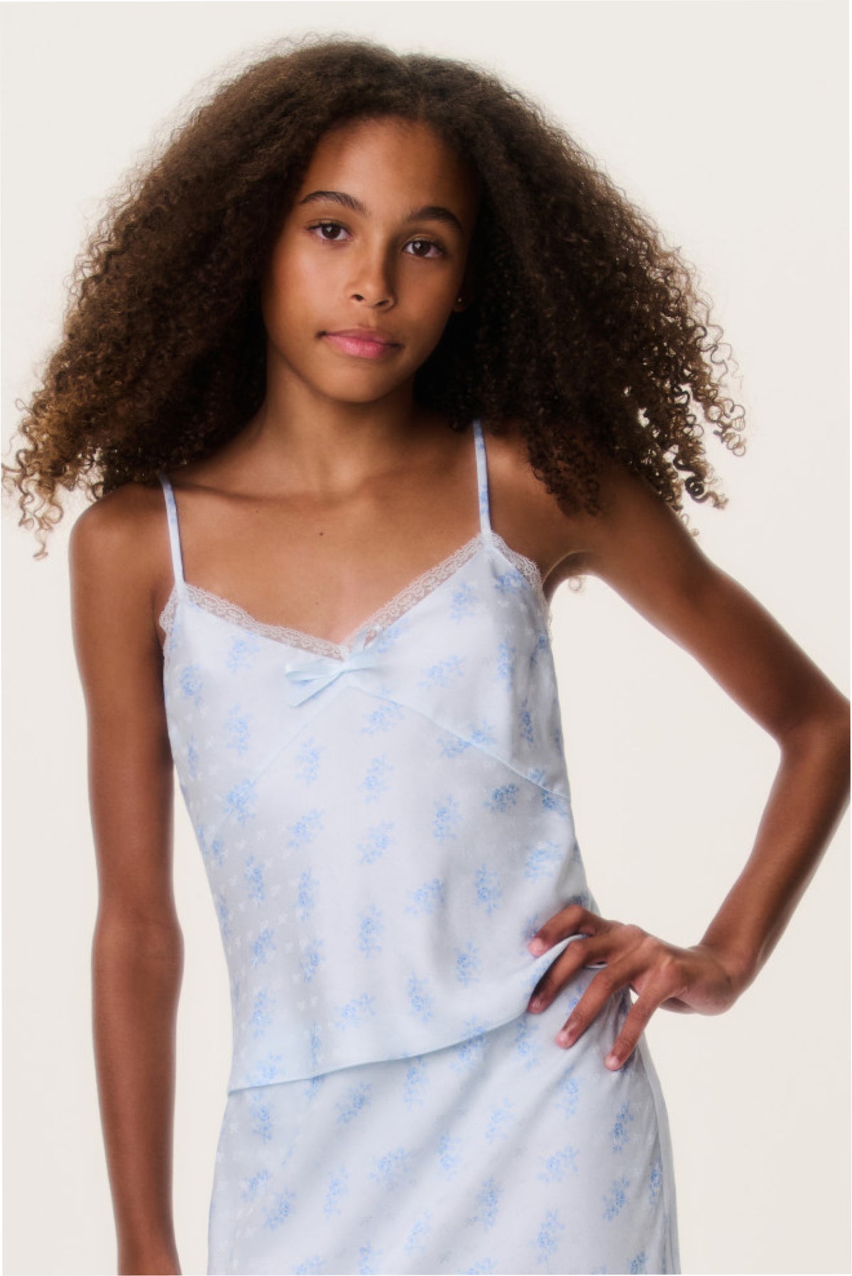 Tween silk-blend cami top close-up, light blue patterned V-neck with spaghetti straps