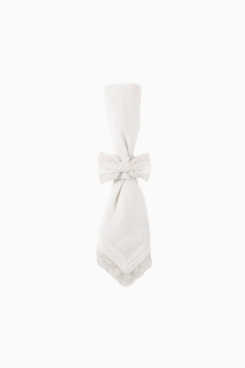 White cloth napkin with bow tie and lace-edged hem, neatly folded