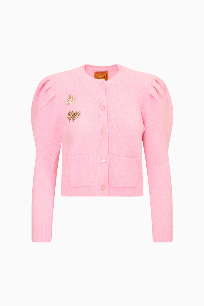 Pink puff-sleeve cardigan with front buttons, embroidered motifs, and patch pockets