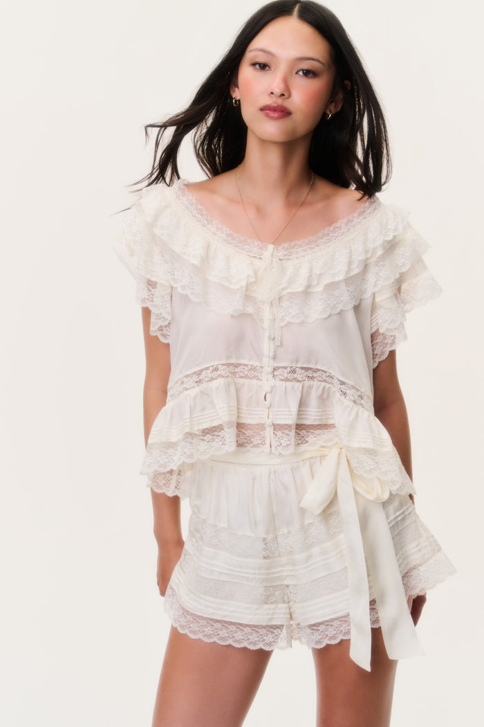 Ivory lace shorts with layered ruffles and wide scalloped lace hem