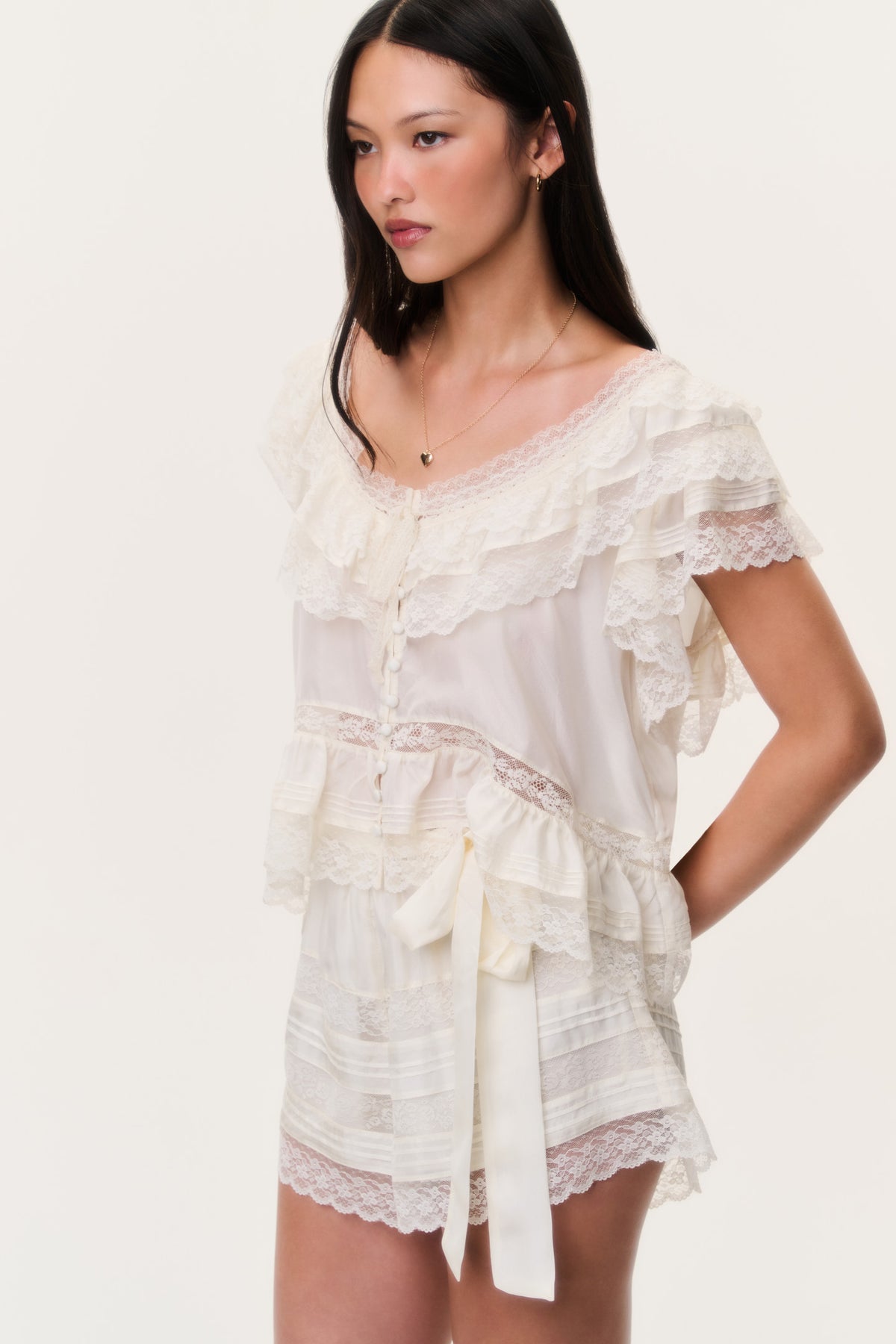 Ivory lace shorts with bow tie waist and scalloped lace edging