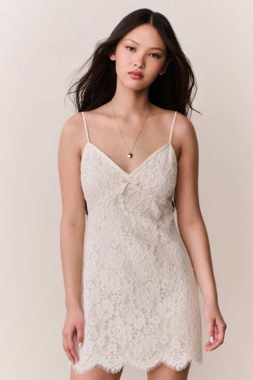 Ivory lace mini dress with spaghetti straps and textured lace panel front